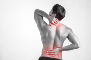 close-up-man-rubbing-his-painful-back-isolated-white-background_1150-2934